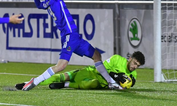 Josh Rae in action for Peterhead.