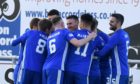 Cove Rangers players congratulate Rory McAllister.