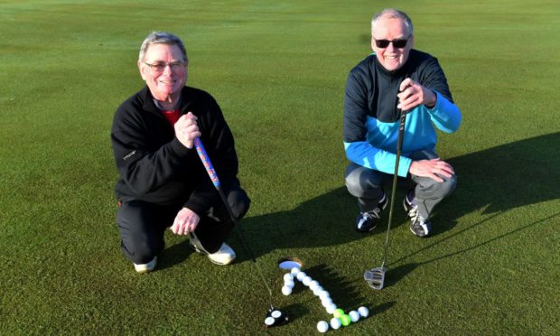 From left, Neil Birnie and George Connon, who both aced the ninth hole on the St Olaf Course at Cruden Bay. Picture by Chris Sumner