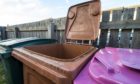 Brown bin permits could be poised to increase in Moray while a temporary reduction in blue and pink bin collections could become permanent.