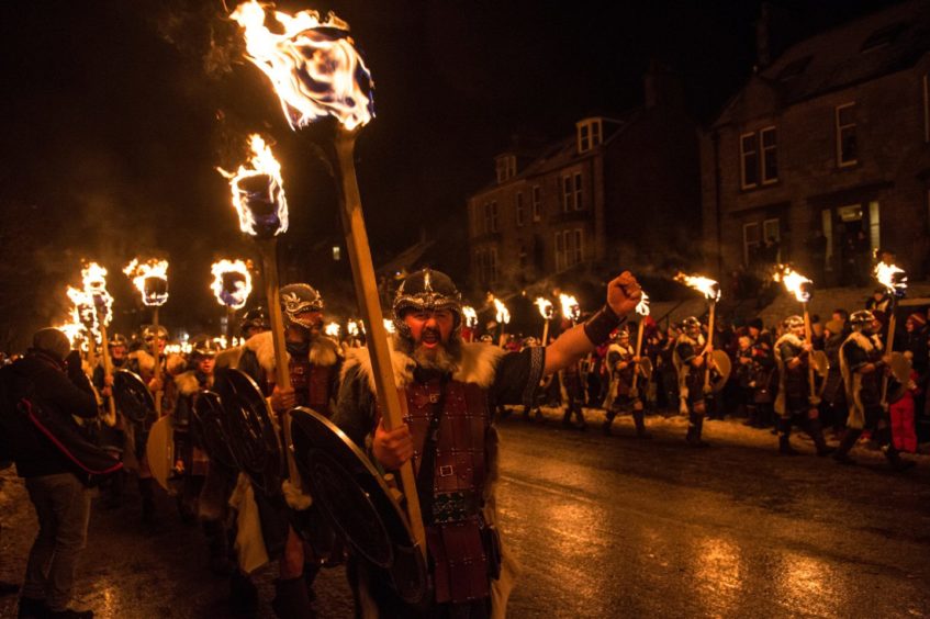 The evening procession of Up Helly through Lerwick, Shetland in 2019.