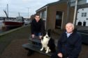Moray MP Douglas Ross with John Mains who was part of the group behind the Burghead harbour shelter committee and his Collie Marsh.