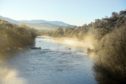 Hoare frost and steam rise from the River Spey at Boad of Garten.