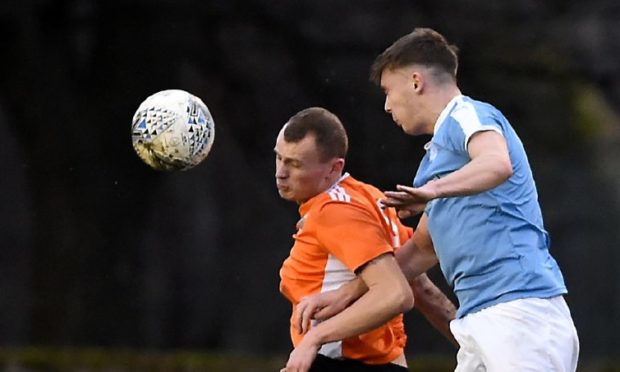 Fraser Dingwall, right, in action for Nairn County against Rothes.