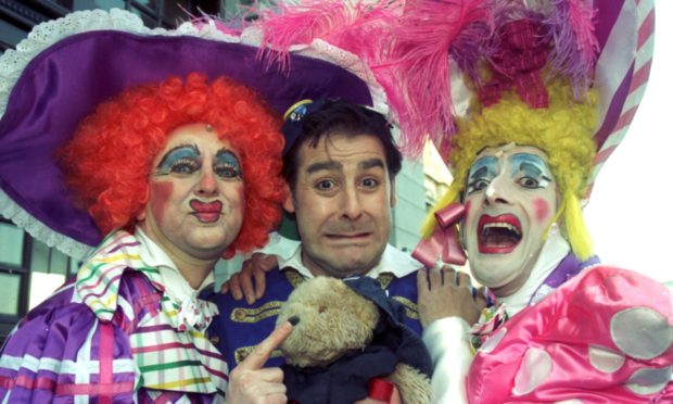 Andy Gray as Buttons in Cinderella at HMT in 1996, with Ugly Sisters Richard Pocock   and William Elliot.