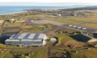 Aerial view of RAF Lossiemouth looking to sea.