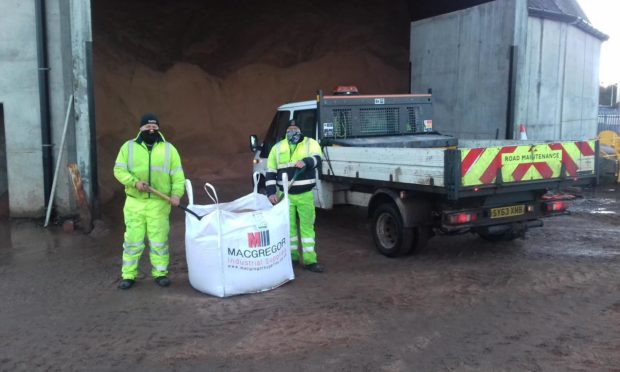 William Blake and Mark Newlands from Moray Council's roads maintenance section leading efforts to provide additional grit to communities to ease pressure on NHS.