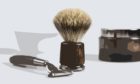 Shaving tools are displayed with a bottle of shaving cream and a cup containing of soap. / Shaving tools.; Shutterstock ID 621199163