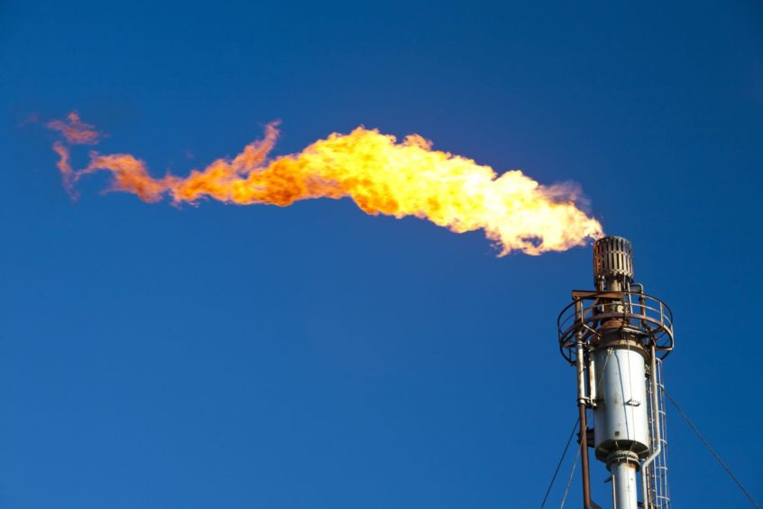 Flaring off gas in the offshore industry.