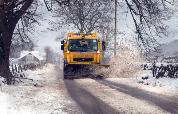 Council snow plough in action in a previous winter