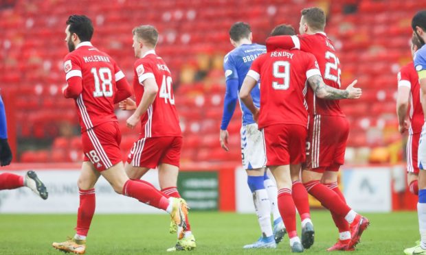 Aberdeen's Callum Hendry is congratulated by Florian Kamberi.