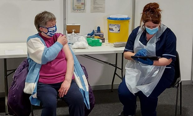 Violet Adams, 78, was first in line at the mass vaccination centre at P&J Live this morning.