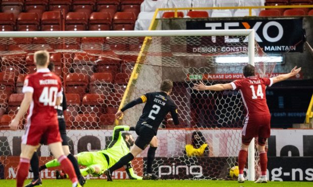 Nicky Devlin heads Livingston into a 2-0 lead against Aberdeen in February.