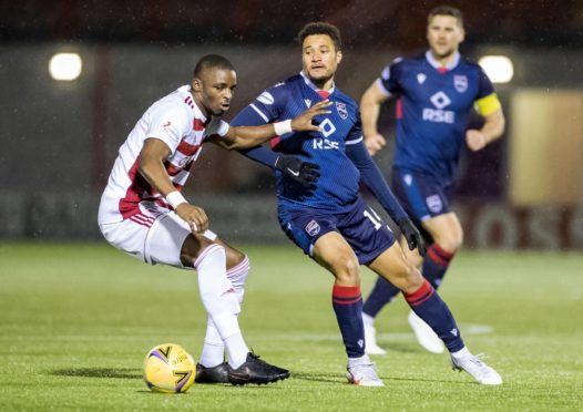 Hamilton's Hakeem Odoffin (left) battles with Ross County's Jermaine Hylton.