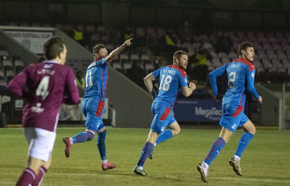 Shane Sutherland celebrates his equaliser for Caley Thistle.