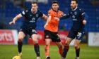 Ross County's Jordan White (left) and Tony Andreu (right) in action against Dundee United's Adrian Sporle.