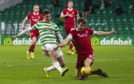 Aberdeen defender Tommie Hoban challenges Patryk Klimala.