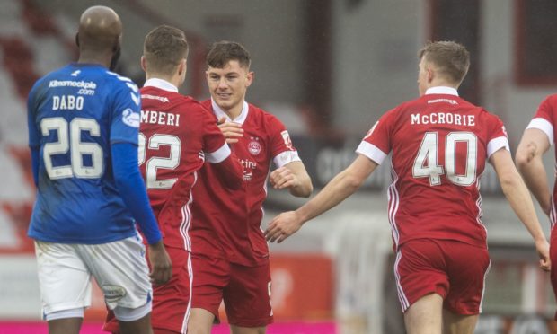 Callum Hendry is congratulated after his first Aberdeen goal.