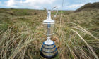 File photo dated 02-04-2019 of A general view of the 18th hole with The Claret Jug at Royal Portrush Golf Club, Northern Ireland.  PA Photo. Issue date: Thursday April 2, 2020. The 149th Open Championship, due to be played at Royal St George’s in July, has been cancelled, organisers have announced. See PA story SPORT Coronavirus. Photo credit should read Liam McBurney/PA Wire.