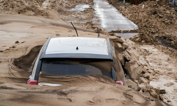 The A98 near Buckie where cars were left buried in muddy snow due to severe weather.