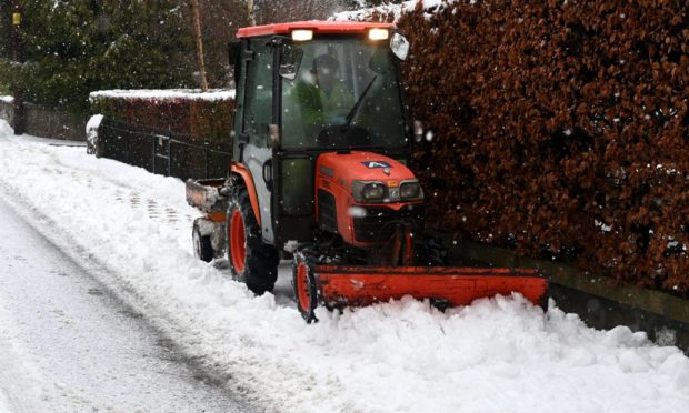 Heavy snow in Aboyne. An amber weather warning covers central, Tayside and Fife, Grampian, the Highlands and Islands and Argyll and Bute.