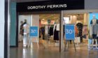 Dorothy Perkins, pictured, will move to an online only future under Boohoo, along with Burton and Wallis, after a £25m deal was stuck