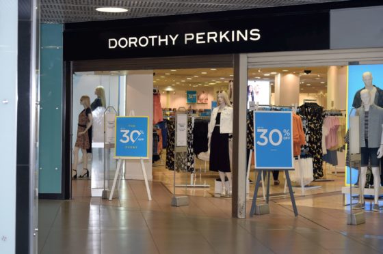 Dorothy Perkins, pictured, will move to an online only future under Boohoo, along with Burton and Wallis, after a £25m deal was stuck