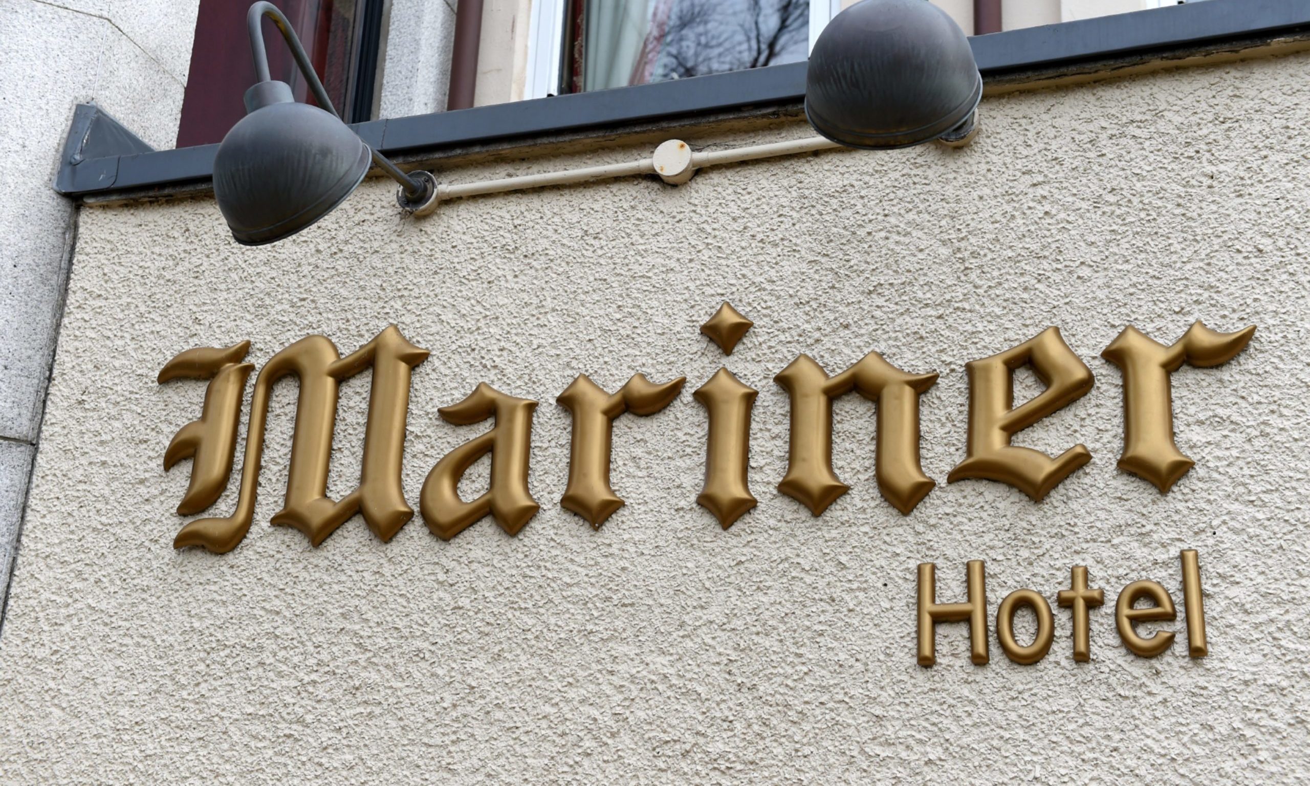 A Mariner Hotel sign hangs on the building.