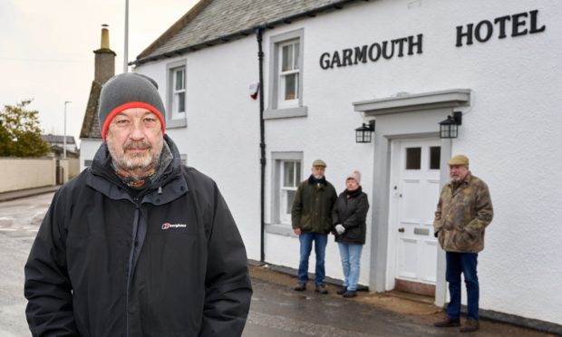 Campaigners in Garmouth are considering a community buyout of the local hotel. Pictured front: Roddy Robertson, chairman of Garmouth and Kingston Amenities Association, with Fiona and Nick Walklet and Nick Adamson.