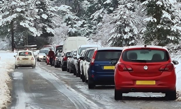 Cars creating log jams at Glenmore.