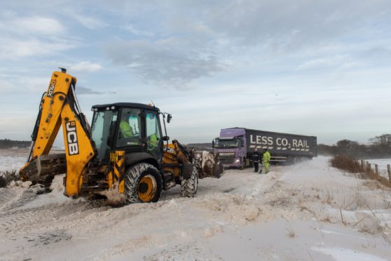 Snow drifts and high winds caused chaos on the A98 Fochabers to Cullen section. Picture by Jason Hedges