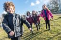 Children from Smithton Primary School near Inverness are pictured leaving school after their first day back after the most recent lockdown.
Pictured are Ewen Robertson P3, Twins Amelia and Isla P2 and Anna Munro P3
Pictures by JASON HEDGES