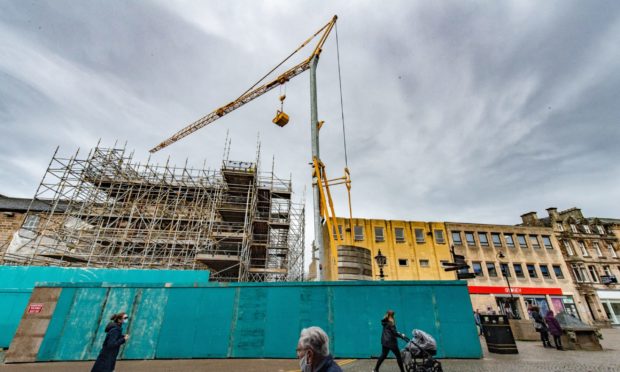 A large crane has arrived at the Poundland building in Elgin.