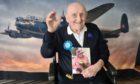 James Crook was given help by Sight Scotland Veterans to read his 100th birthday card from the Queen.