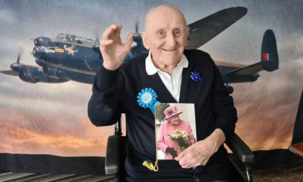 James Crook was given help by Sight Scotland Veterans to read his 100th birthday card from the Queen.