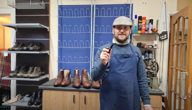 Elgin Shoe Repair's owner Kenny Morran dressed up as Peaky Blinder.