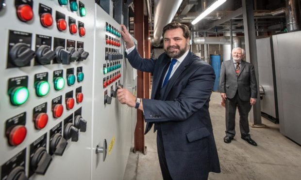 Councillor John Wheeler switches on the new district heating power supply at Tillydrone Energy Hub with Aberdeen Heat & Power Chairman Ramsay Milne.