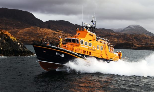 Mallaig lifeboat has transported the woman to the mainland after she injured her wrist in a fall.