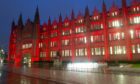 Marischal College lit up in red for Care Day