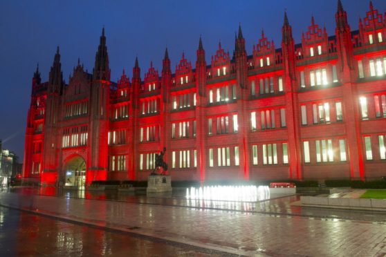 Marischal College lit up in red for Care Day