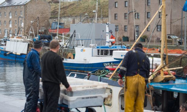 Fishermen at Burghead Harbour.