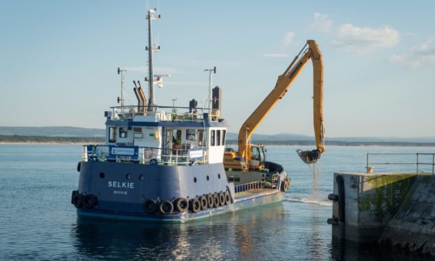 Selkie dredging at Burghead Harbour.