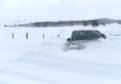 A car is almost submerged in snow at Nethy Bridge.