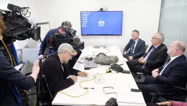 FACING THE PRESS: From left, Dr Boyd Peters, interim medical director, Professor                      Boyd Robertson, interim chairman and Iain Stewart, chief executive in 2019.