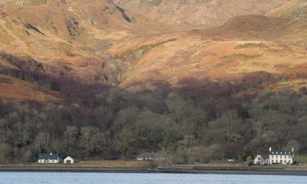 The mountains of Knoydart under a cap of snow with Loch Nevis in the foreground.