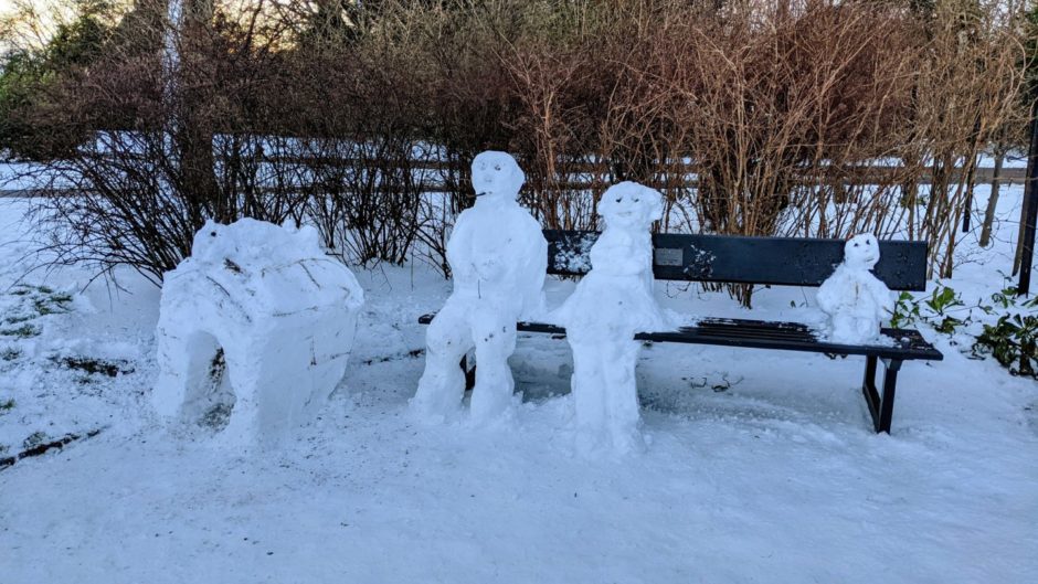 One snow family found it all too much and required a rest on one of the park's public benches
