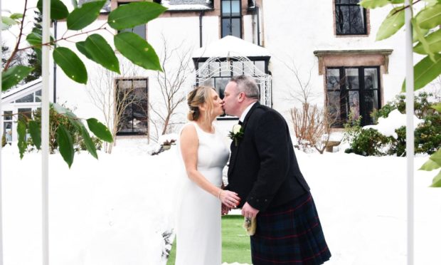 Pauline and John Redford at the ceremony. Picture from Logan Sangster/Deeside Photographics