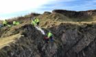 Coastguard rescue teams save the Jack Russel Mutley near the Bow Fiddle Rock, Portknockie.