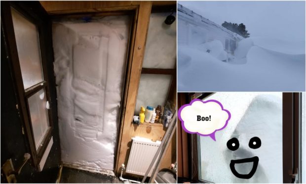 A huge snow wall has formed at the front door of the Robertson family