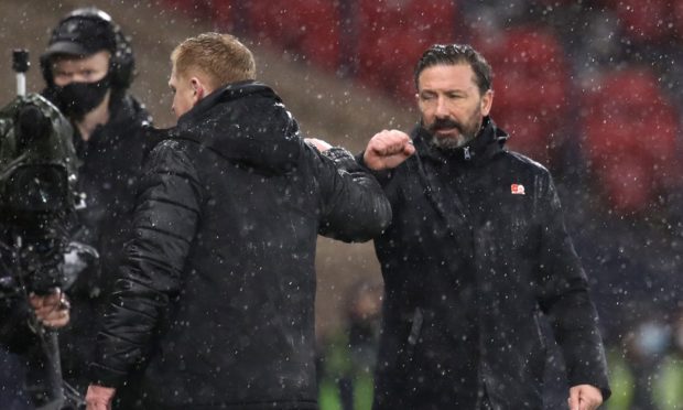 Aberdeen manager Derek McInnes (right) fist bumps Celtic manager Neil Lennon after the William Hill Scottish Cup semi final match at Hampden Park in November.